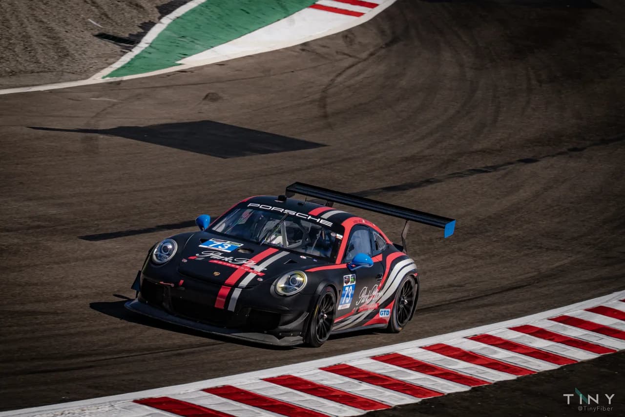 Porsche race car photographed trackside by Arthur Wei